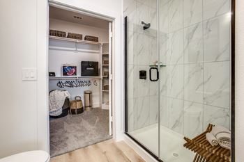 Walk-in closets with custom wood shelving